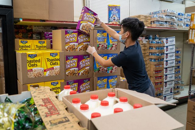 Teens prepare food baskets for patrons at the Reaching Out Community Services food pantry on August 11, 2022 in Brooklyn. New data shows demand remains elevated for pantries and soup kitchens citywide.